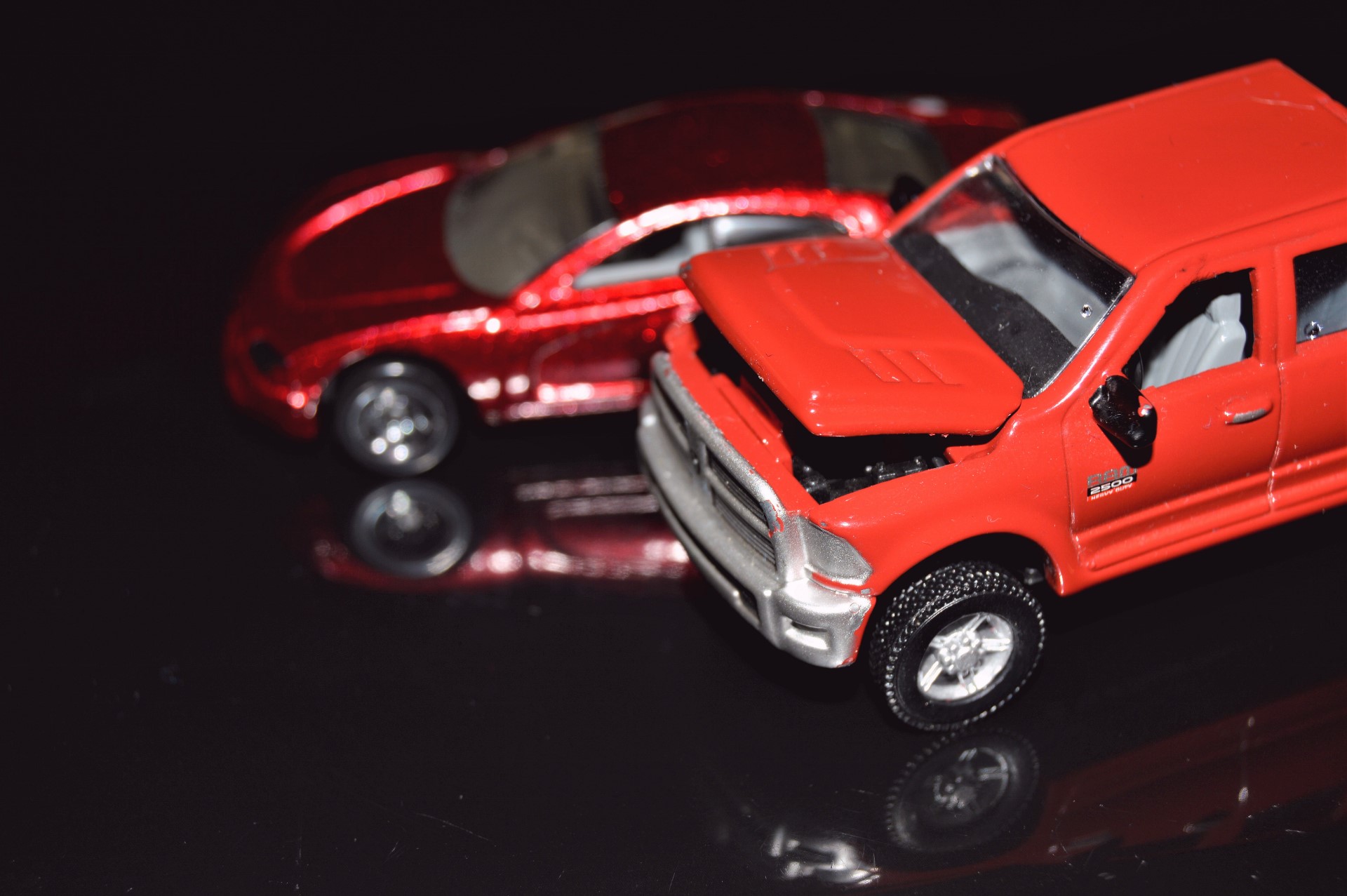 Dodge diecast model cars - Dodge Charger concept and a Dodge Ram 2500 gen 4, both of them using plastic wheels, although the pickup truck comes with rubber tires.