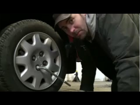 Changing a Flat Tire Using The Tools In Your Car